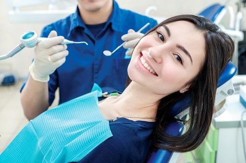 woman sitting in dental chair in eagle River