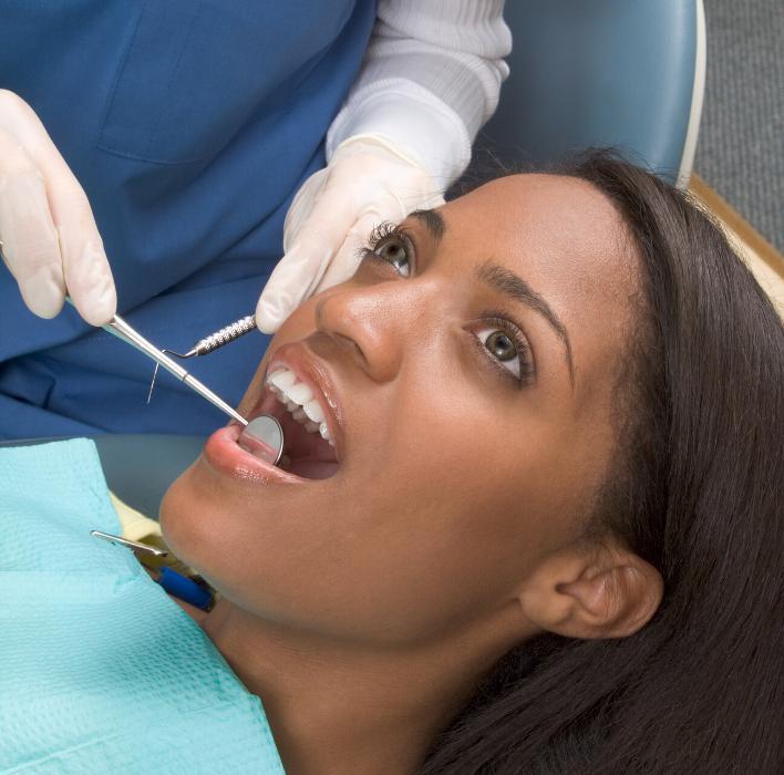 woman getting tooth extracted
