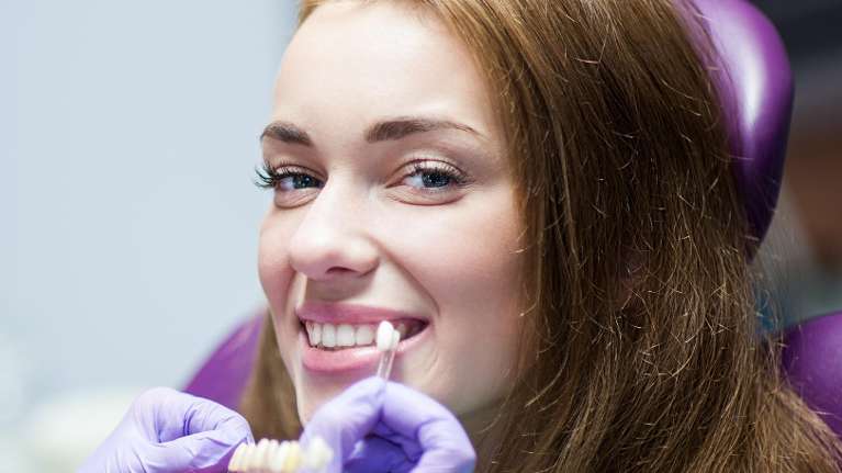 woman getting teeth whitened in eagle river