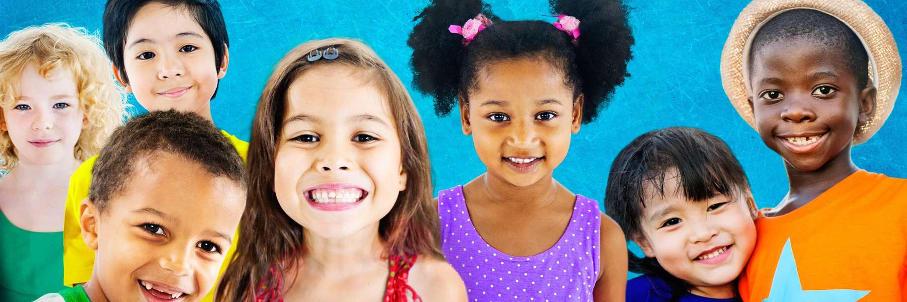 a group of young children smiling 