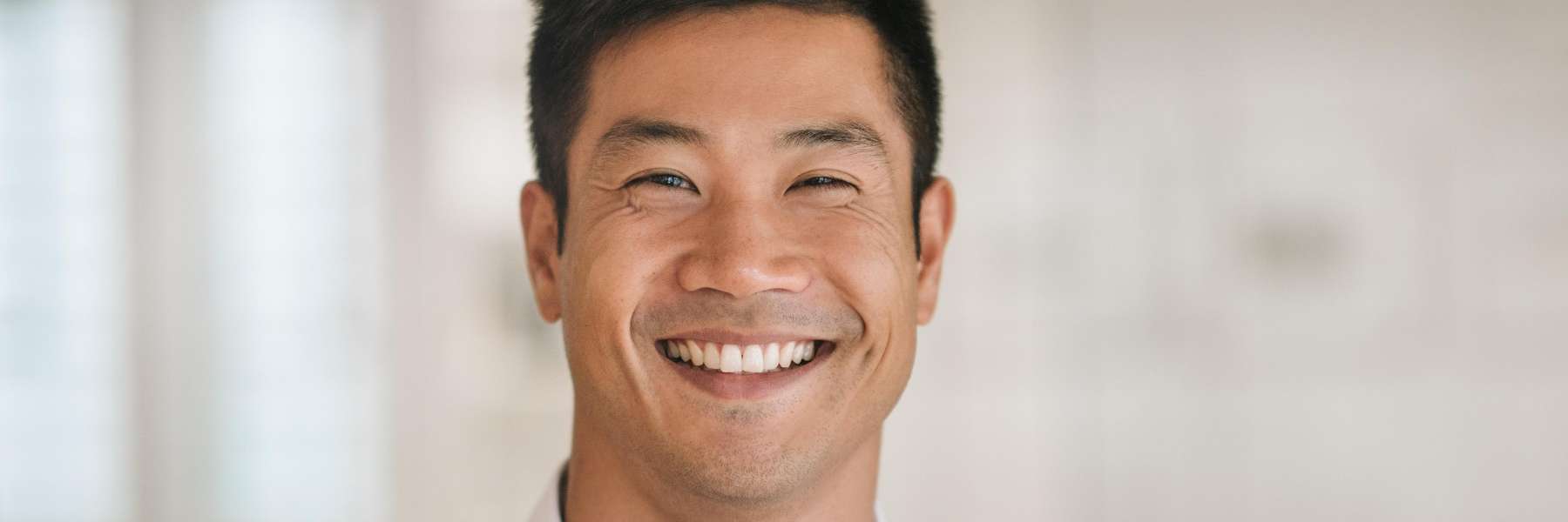 man smiling after getting teeth whitened