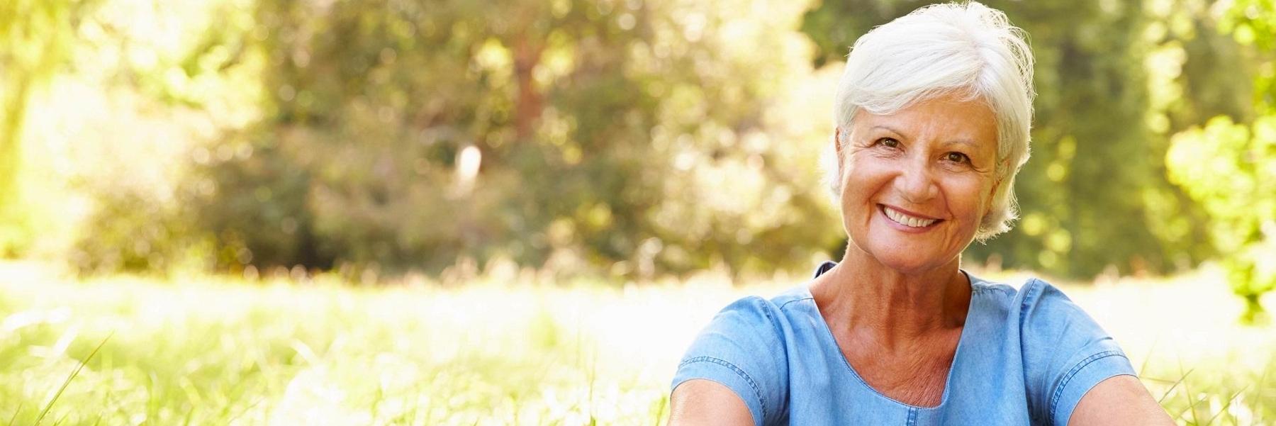 woman smiling after getting dental crowns in eagle river