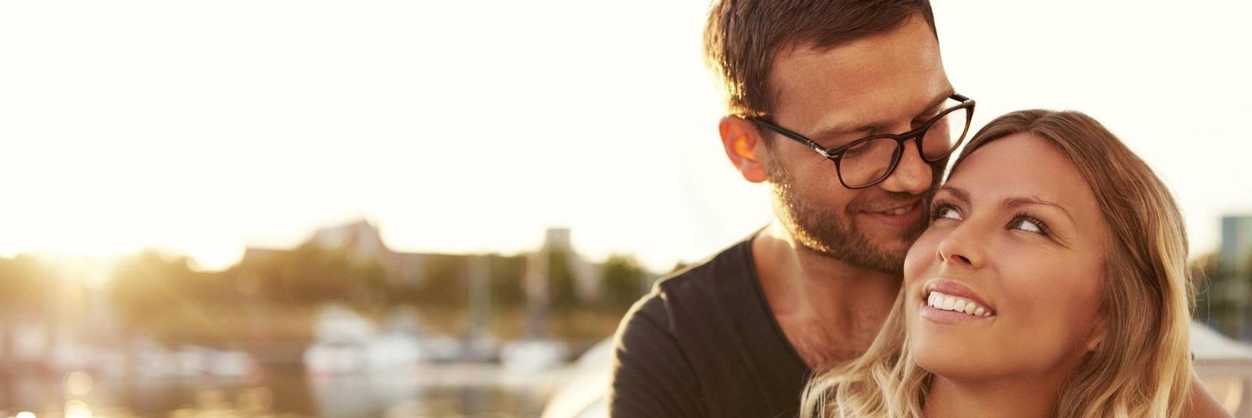 male and female couple smiling 