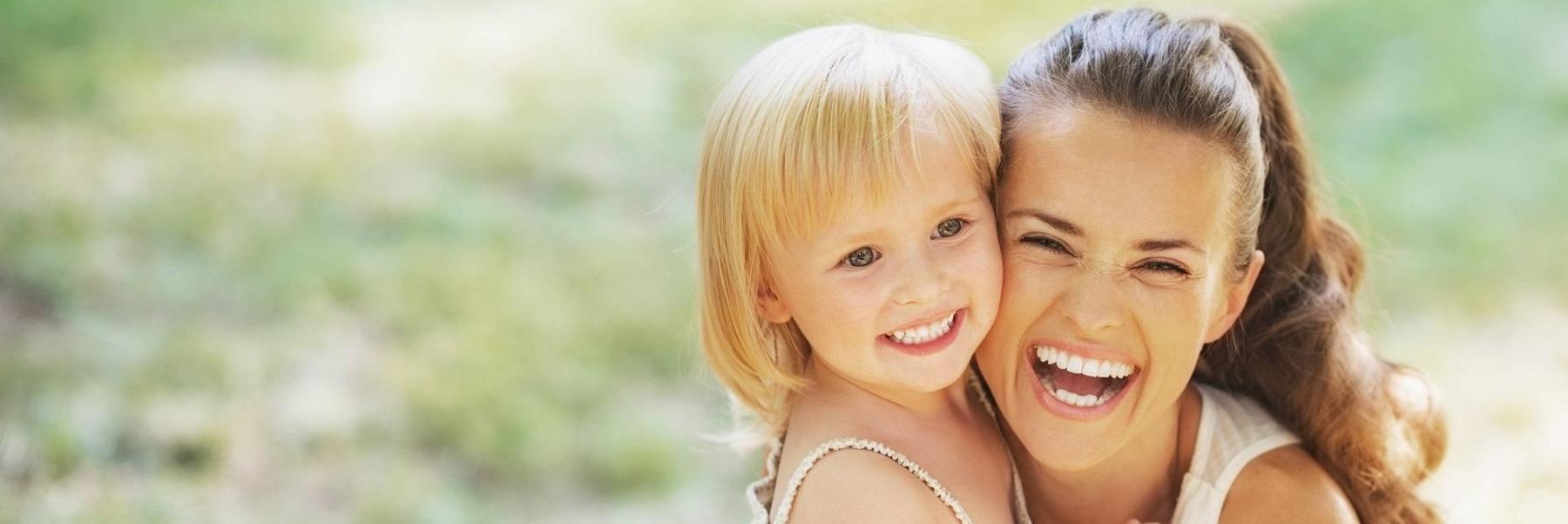 Mother and daughter smiling