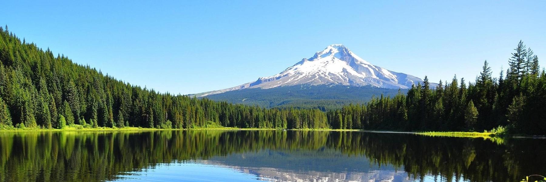 scenic picture of a mountain and a lake in the woods